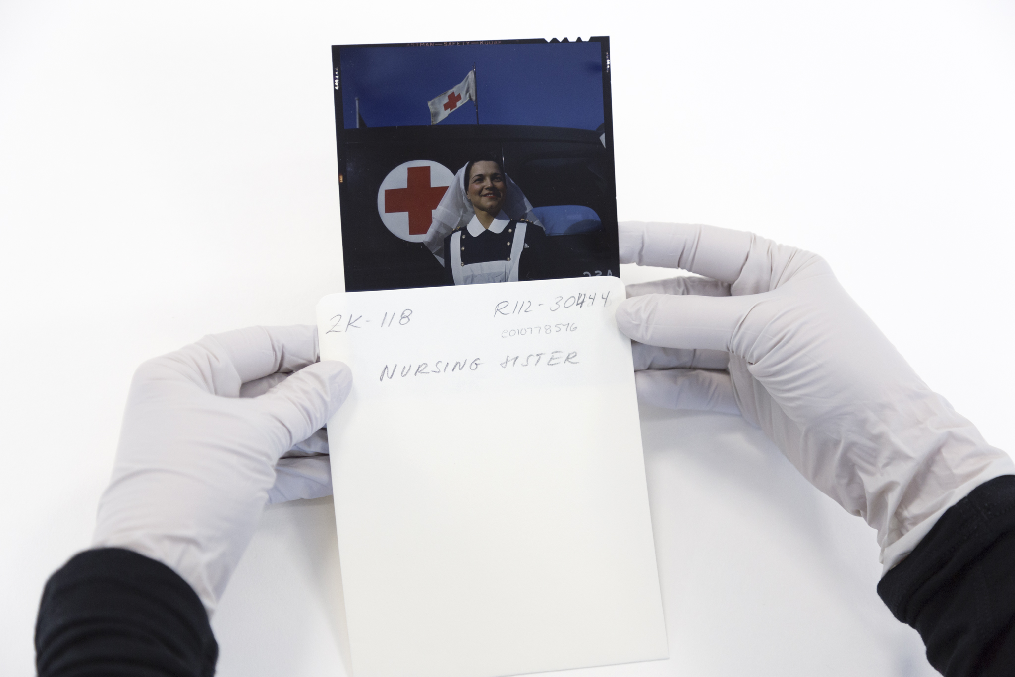 Colour transparency being removed from an envelope.