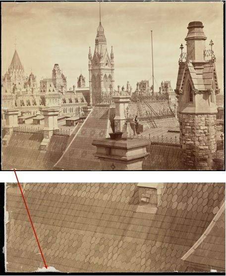 A view of the rooftops of Parliament. Loss of photographic support along the edges. A close-up of emulsion loss.