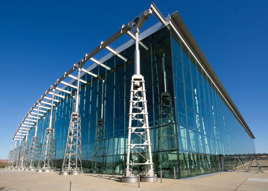 Preventative Care. Image of a modern-looking building with glass walls and a metal ceiling.