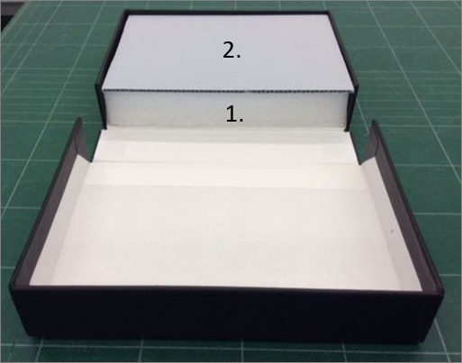 Open box with corrugated blue board spacer  