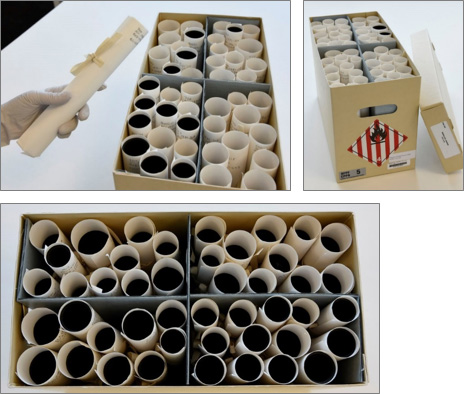 box containing paper rolls of rolled nitrate separated in four sections by the spacer assembly