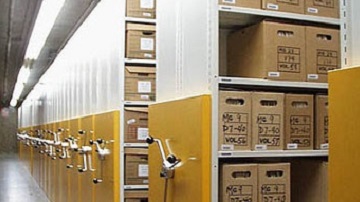 Photograph of the mobile shelving units used to store boxed textual records